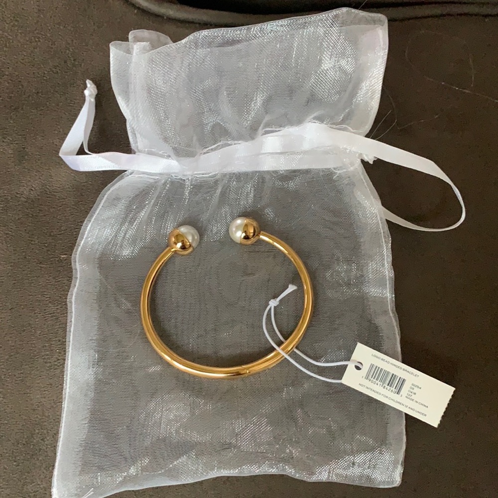 Tory Burch logo hinged bracelet